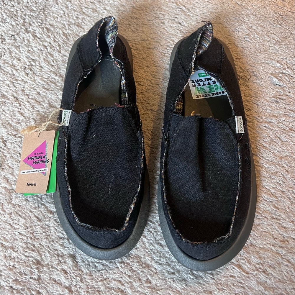 Sanuk Women’s Black Sidewalk Surfers Slip-On Shoes